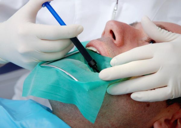 dentist examining little girl